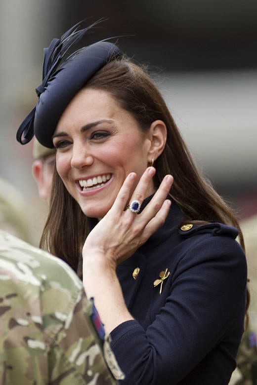 Kate Middleton wearing blue sapphire and diamonds engagement ring.