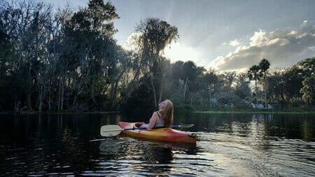 I get my glow on kayaking the Silver River as the sun is rising.