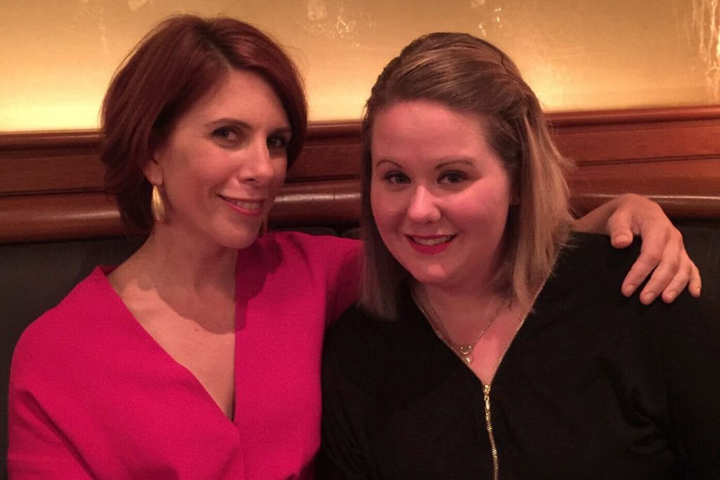 Emma and Janelle sharing drinks in NYC.