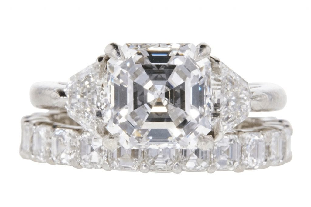 3-stone ring featured a 2.19 carat Asscher cut diamond