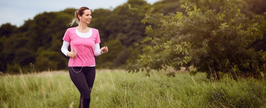 A woman jogging in a field